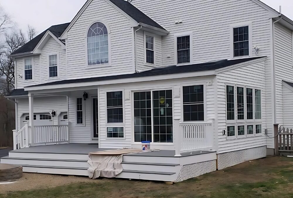 Completed sunroom and deck addition built by Lagace Construction to expand outdoor living space